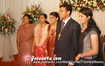Thomas Meenu Wedding photos at bharat matha college auditorium
